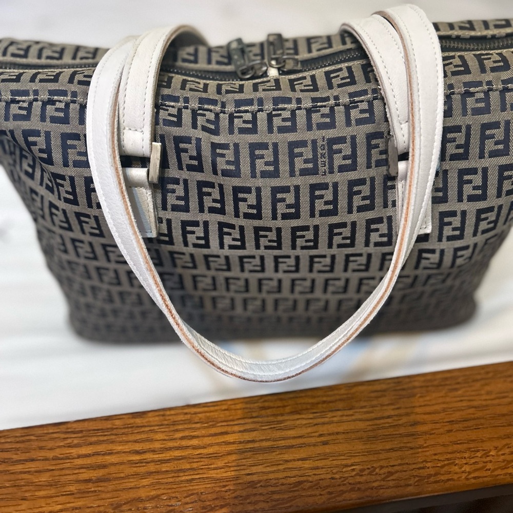 Fendi Zucchino canvas shoulder bag w/Navy color logo/white leather straps.